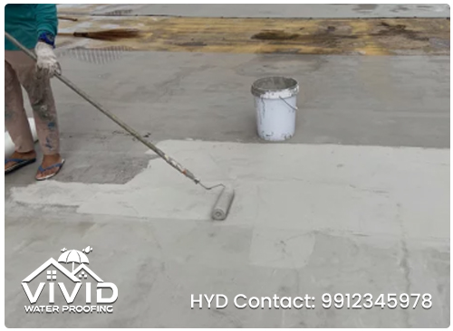 Man working on roof with paint roller